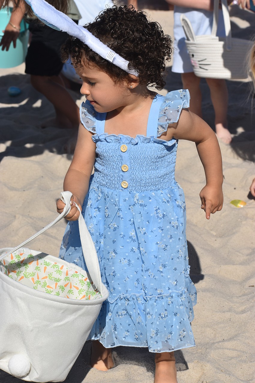 Parrish's Emma Alonso, 2, searches for the perfect egg during Eggstravaganza at Waterside Park March 28.