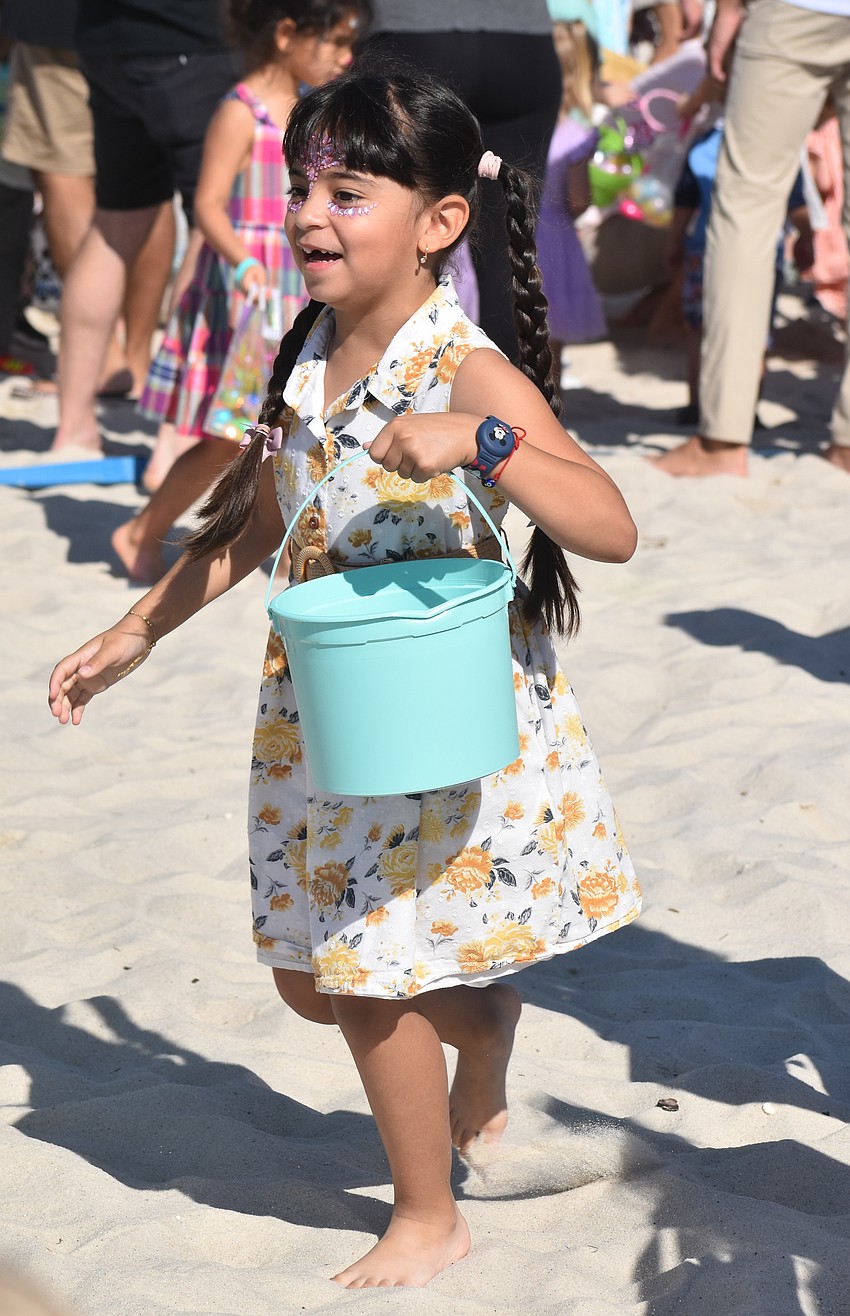 Lakewood Ranch's Paulina Marin, 5, races to get as many eggs as she can during Eggstravaganza March 28.