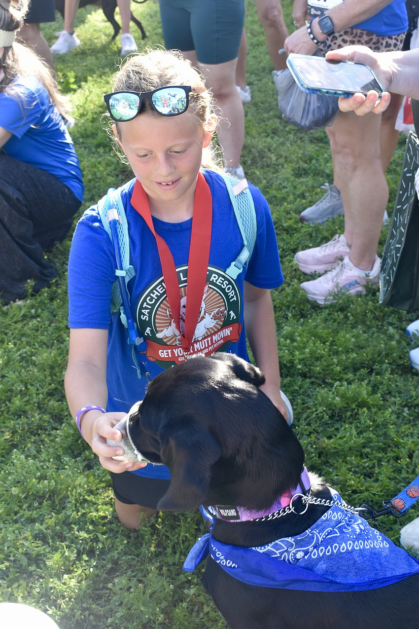 Nora Eck, 11, feeds Ruthie during the pie eating contest.