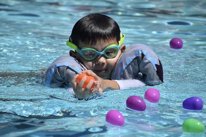 Rene Moser, 3, finds and egg.