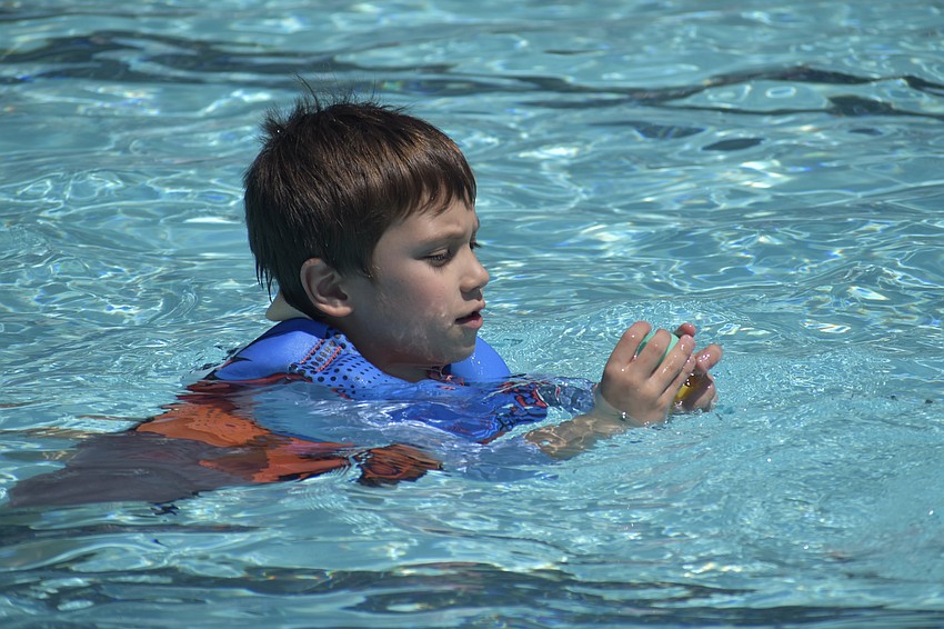 Keanu Nakayama, 6, finds an egg.