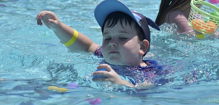 Roland Nyarfadi, 7, finds an egg.
