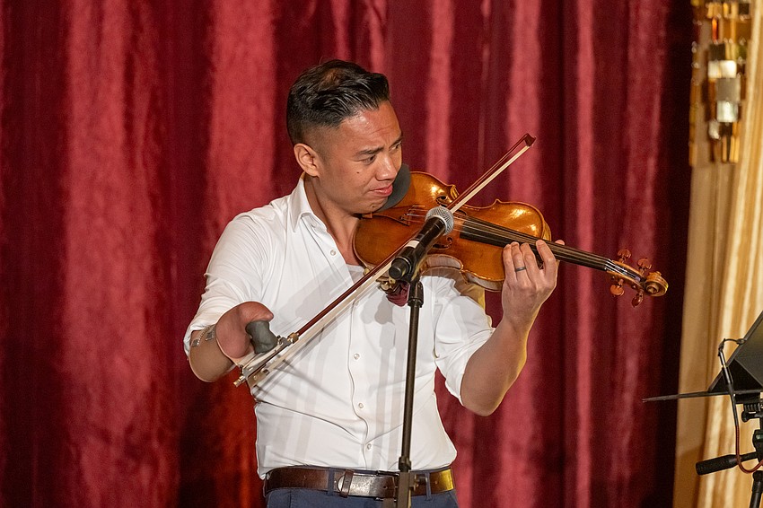 Adrian Anantawan performs for attendees.