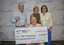 John Saputo (left), Denise Saputo (top center), Lorraine Vitale (right) and Dick Vitale (bottom center) at the "March Mayhem" fundraiser and Elite Eight watch party. The Saputos were the hosts March 28 at Gold Coast Eagle Distributing.