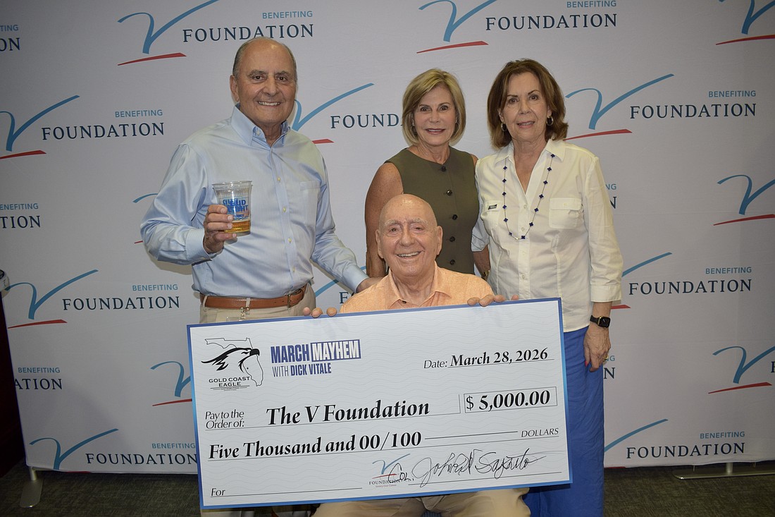John Saputo (left), Denise Saputo (top center), Lorraine Vitale (right) and Dick Vitale (bottom center) at the "March Mayhem" fundraiser and Elite Eight watch party. The Saputos were the hosts March 28 at Gold Coast Eagle Distributing.