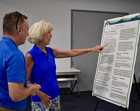 Kelley Klepper, a vice president and senior planner for Kimley-Horn, speaks with Indigo’s Suzanne Henke following the Envision Manatee presentation at the Lakewood Ranch Library March 28.
