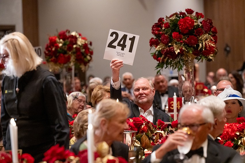 Don Patterson raises his paddle for Easterseals.