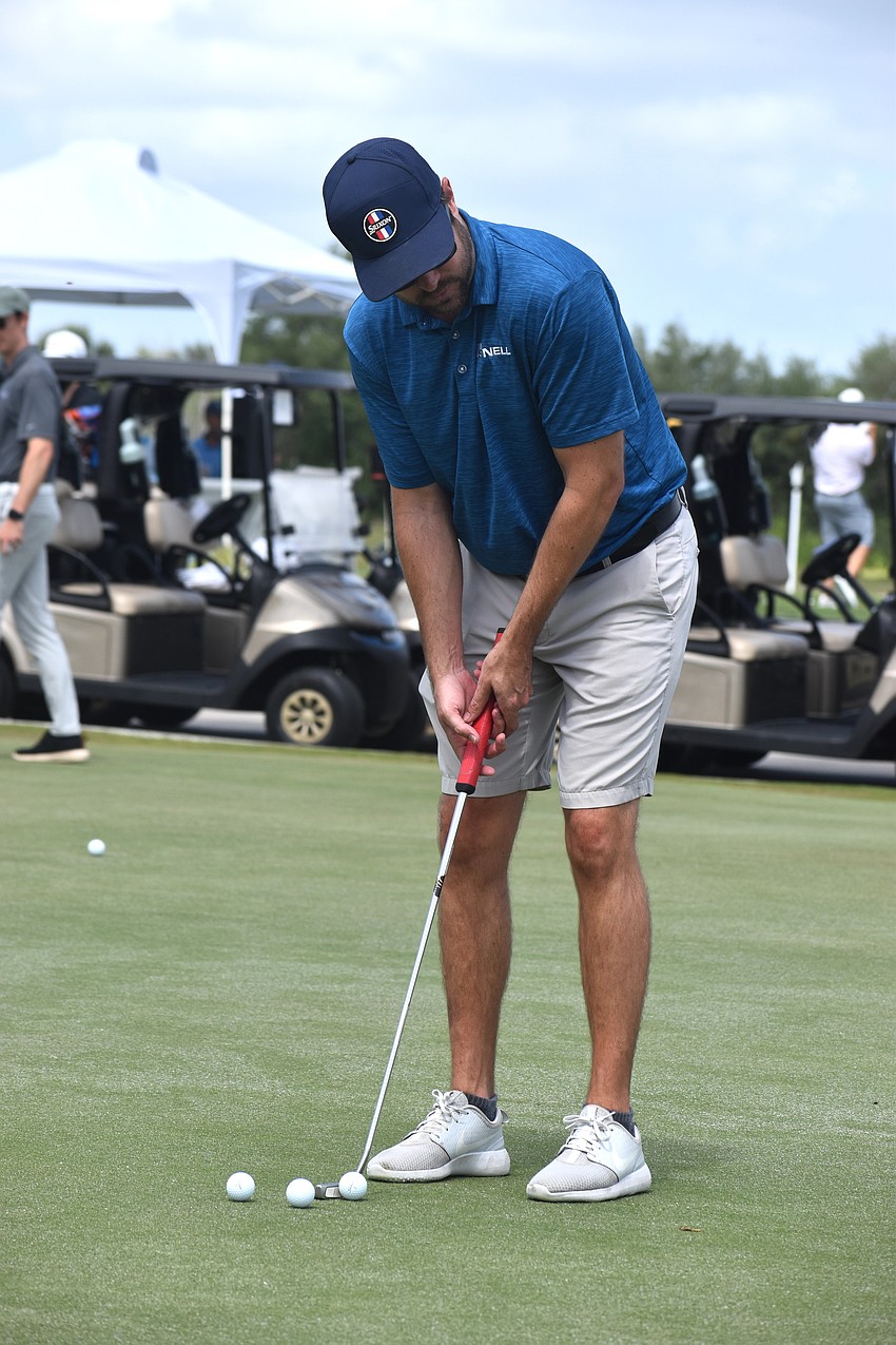 Craig Stevenson of Snell Engineering practices his swing before taking off to compete in the Lakewood Ranch Business Alliance Ranch Scramble on March 30.