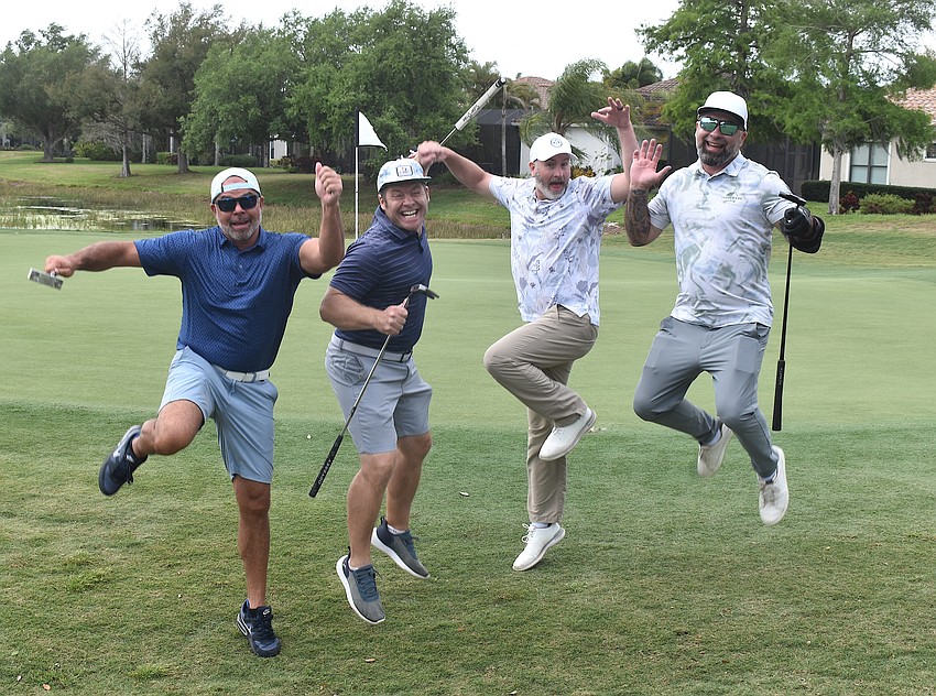 Trademark Roofing's Jeff Parker, Tristan Starbird, Jason Harper and Devin Tyler are happy to golf in the Lakewood Ranch Business Alliance Ranch Scramble.
