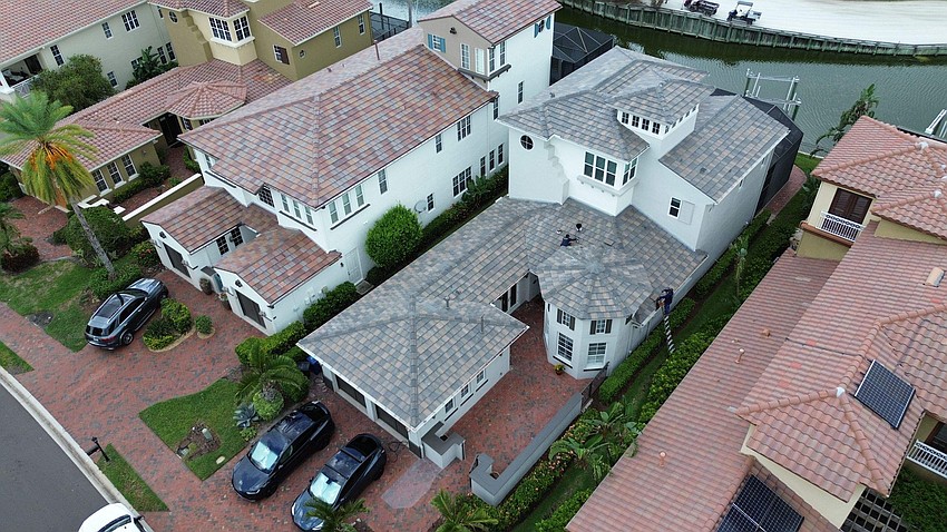 Roofing by Curry installed residential roofing and gutters on a home in  the Fish Hook community.
