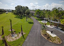 Sarasota's Alderman MURT includes a rest area with a shade shelter, drinking fountain, benches and tables, and a bike repair station as well as landscaping.  This view looks east, toward School Avenue.