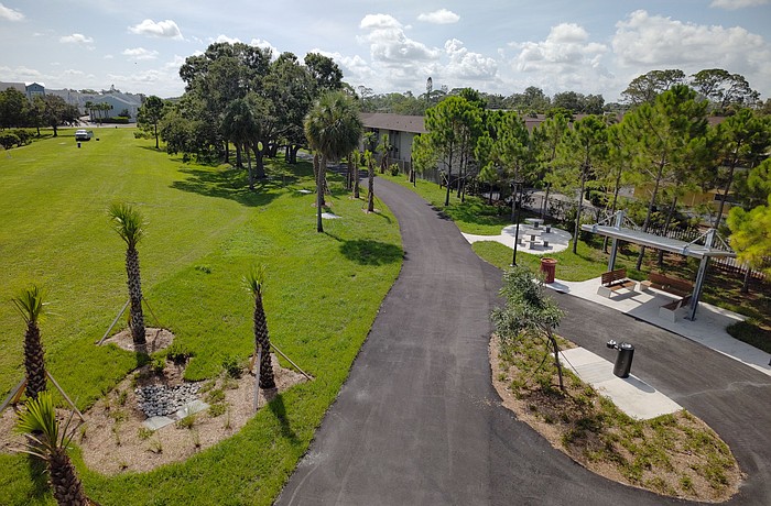 Sarasota's Alderman MURT includes a rest area with a shade shelter, drinking fountain, benches and tables, and a bike repair station as well as landscaping.  This view looks east, toward School Avenue.