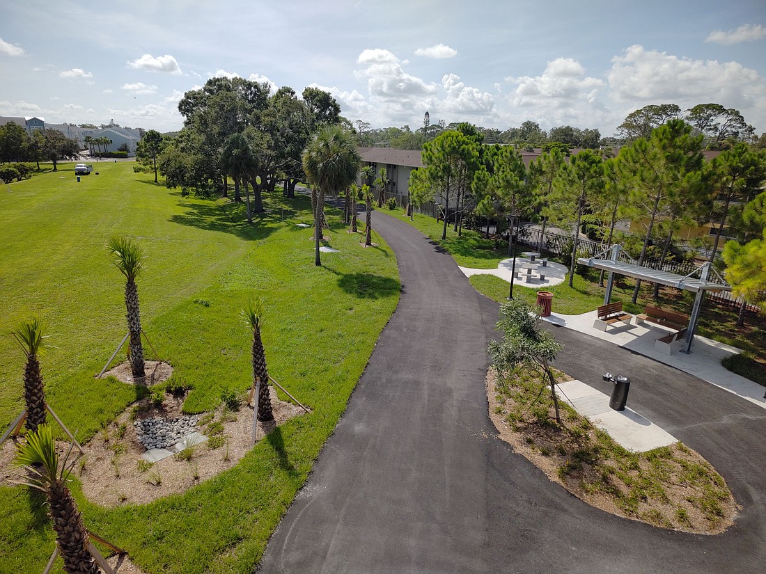 Sarasota's Alderman MURT includes a rest area with a shade shelter, drinking fountain, benches and tables, and a bike repair station as well as landscaping.  This view looks east, toward School Avenue.