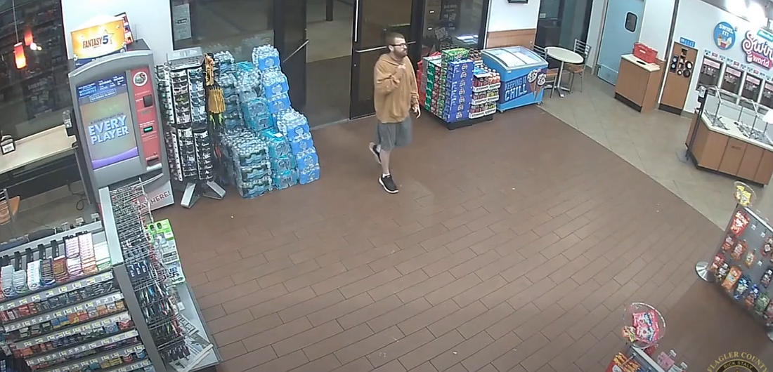 Suspect captured in a surveillance video screenshot during a Palm Coast cigarette theft.