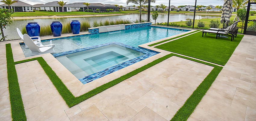 Superior Pools of Southwest Florida's Condenzio pool includes artificial turf inlays and a flush (zero raise) spa with extended tile spillway surrounded by six-foot wide trough.