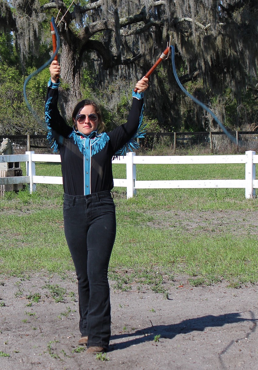 After just four years, Sydney McCullough has become so adept at cracking whips that it now is part of the show at Herrmann's Royal Lipizzan Stallions in Myakka.