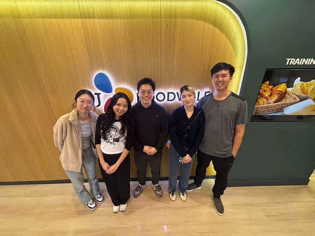The leadership team at Tous les Jours includes, from left to right, Amy Zheng, front house manager; Stefani Go and Andy Yang, owners; Luna Zheng, cakes manager; and Ollie Zheng, baking manager.