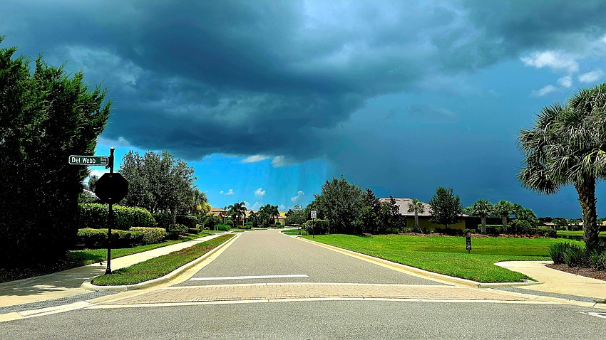 Gordon Silver captured this photo of a rain shower on one end of the street but clear skies on the other side in Del Webb.
