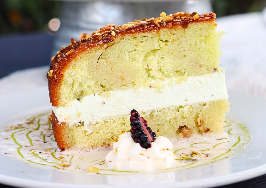 Harry’s Heaven’s Door bourbon cake layers rich pistachio cream between tender cake, then finishes with a sweet glaze for a bold finale.