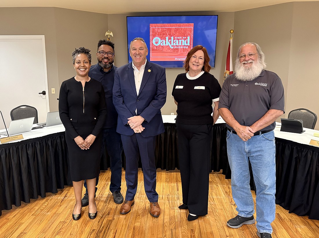Commissioners Yumeko L. Motley, Joseph McMullen and Kris Keller smiled with Oakland Mayor Shane Taylor and Vice Mayor Michael Satterfield after taking their oaths of office.