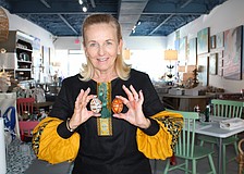 Pysanky expert Roksolana Tymiak-Lonchyna shows some examples of the traditional egg decoration patterns.