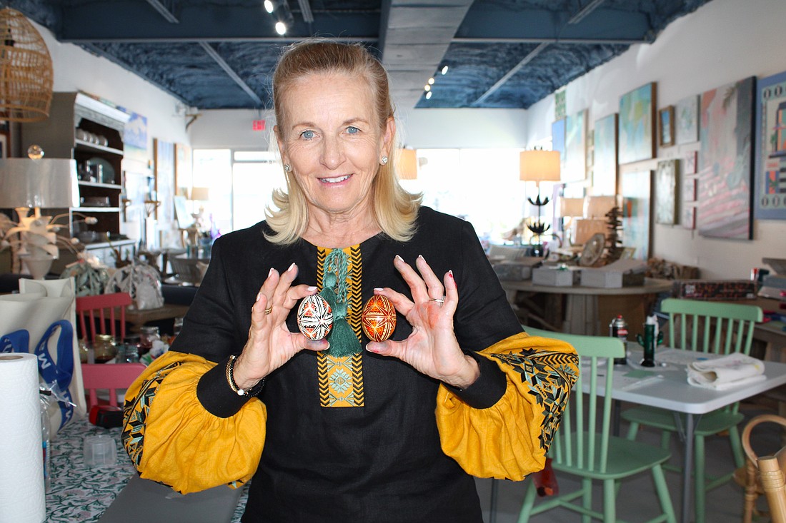 Pysanky expert Roksolana Tymiak-Lonchyna shows some examples of the traditional egg decoration patterns.