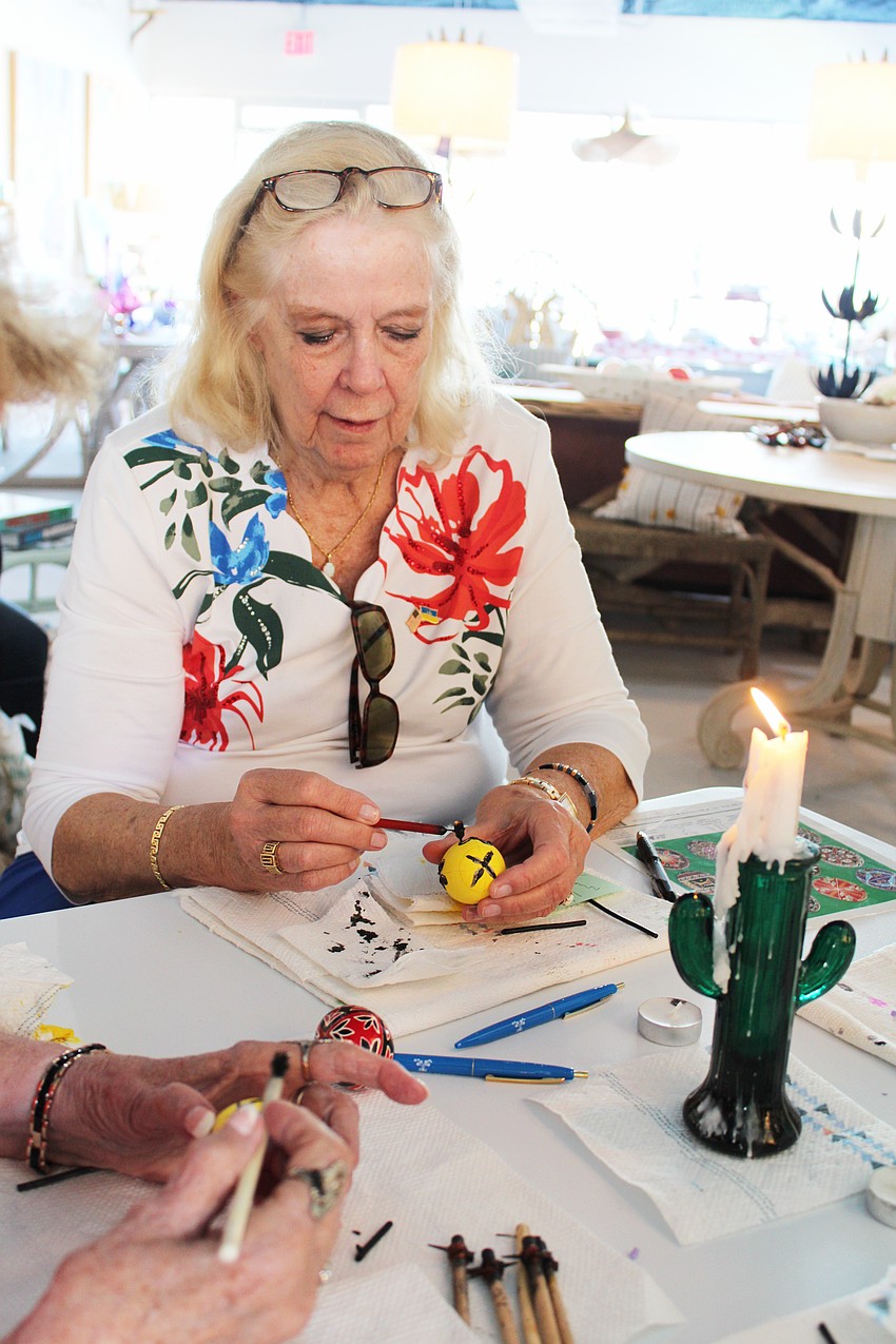 Cheryl Jurcik works on her pysanky design.