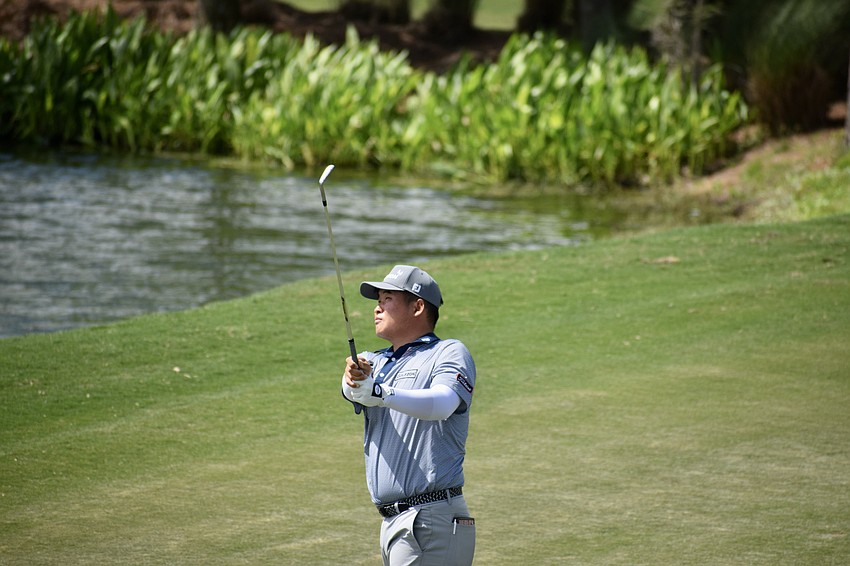 Norman Xiong hits his approach shot on the 11th hole. He has two Korn Ferry Tour wins in his career, but April 2, was even through 12 holes.