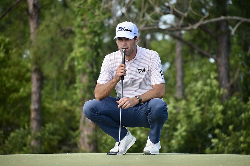 Ben Martin pauses to read the fourth green. The 38-year-old American, who has two Korn Ferry Tour wins, finished four under par — five strokes behind the leader.