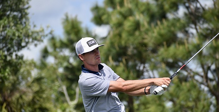 Hunter Eichhorn watches his approach shot fly on the ninth hole. He already has four top-10 finishes this season on the Korn Ferry Tour, and leads the LECOM Suncoast Classic after round one at nine under par.