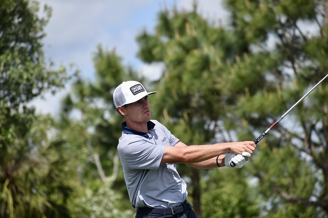 Hunter Eichhorn watches his approach shot fly on the ninth hole. He already has four top-10 finishes this season on the Korn Ferry Tour, and leads the LECOM Suncoast Classic after round one at nine under par.