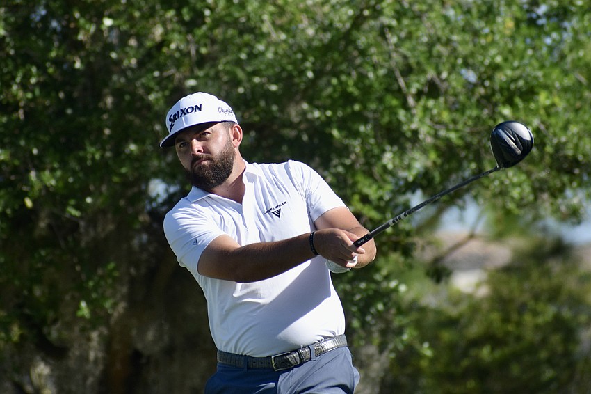 Hayden Buckley, the 2021 LECOM Suncoast Classic champion, hits a drive on the second hole. He finished five under par and was tied for ninth place when play was suspended.