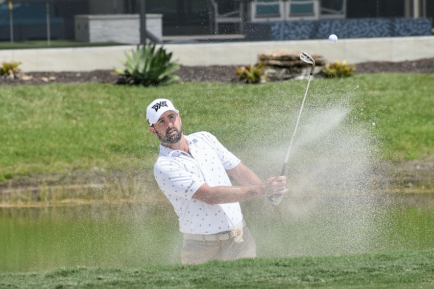 Cristobal Del Solar hits a sand shot on the 12th hole. He was two over par through 10 holes.