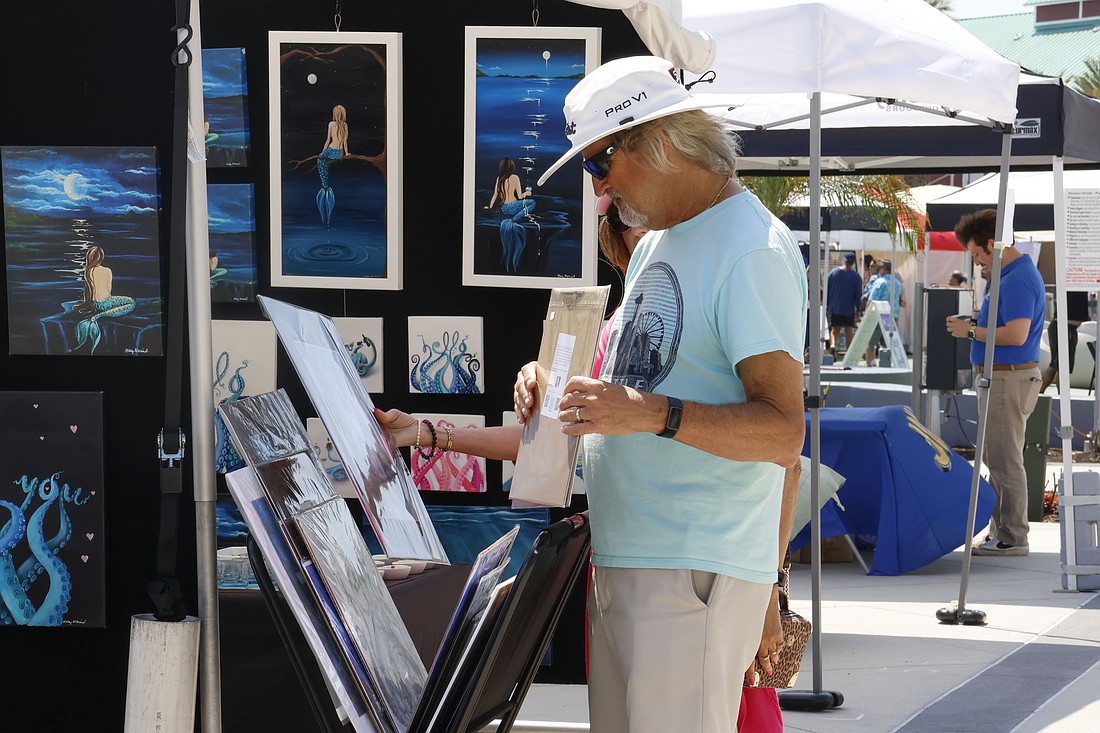 People look through art at the seventh annual One Daytona Art Festival. Photo courtesy of Alexis Meadows