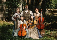 The cast of Asolo Rep's "Fiddler on the Roof" poses with instruments.