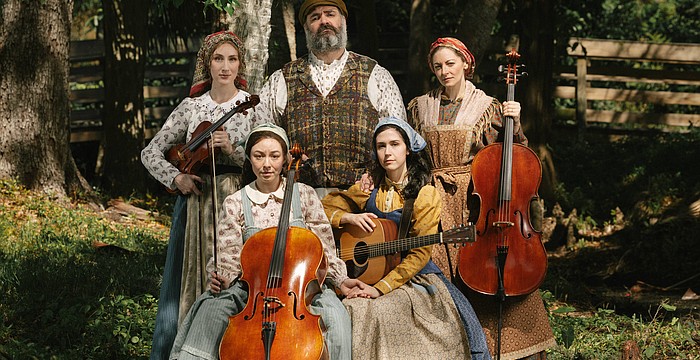 The cast of Asolo Rep's "Fiddler on the Roof" poses with instruments.