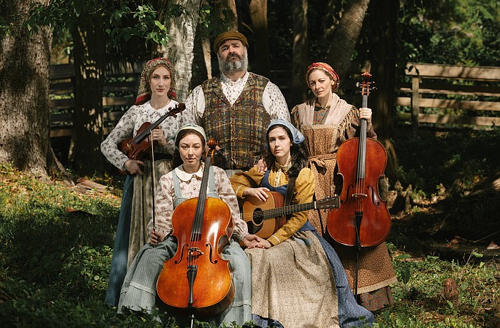 The cast of Asolo Rep's "Fiddler on the Roof" poses with instruments.