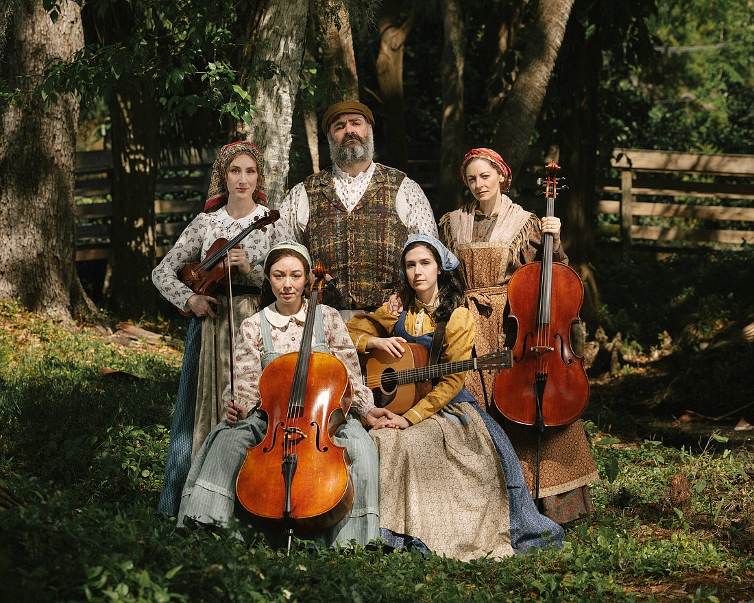 The cast of Asolo Rep's "Fiddler on the Roof" poses with instruments.