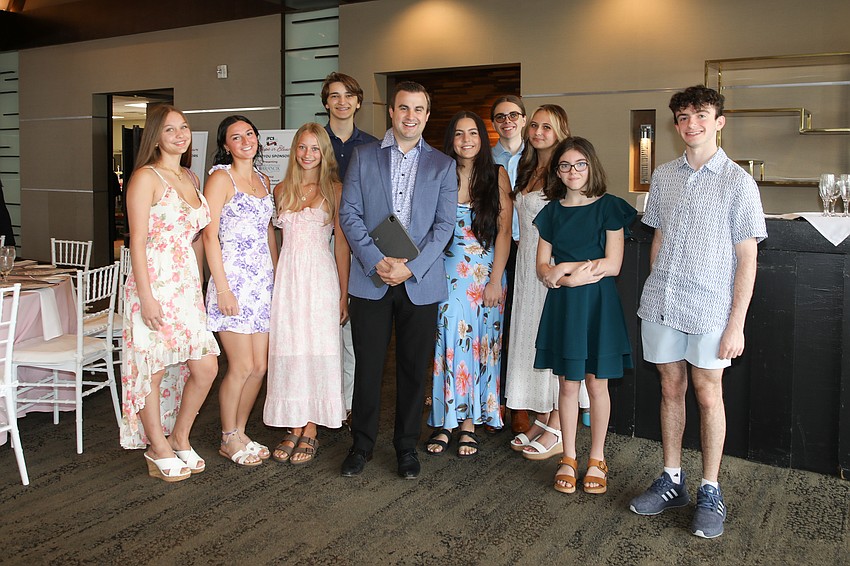 Led by Erick Crow, The Out-of-Door Academy Concert Choir performs for Hope in Bloom.