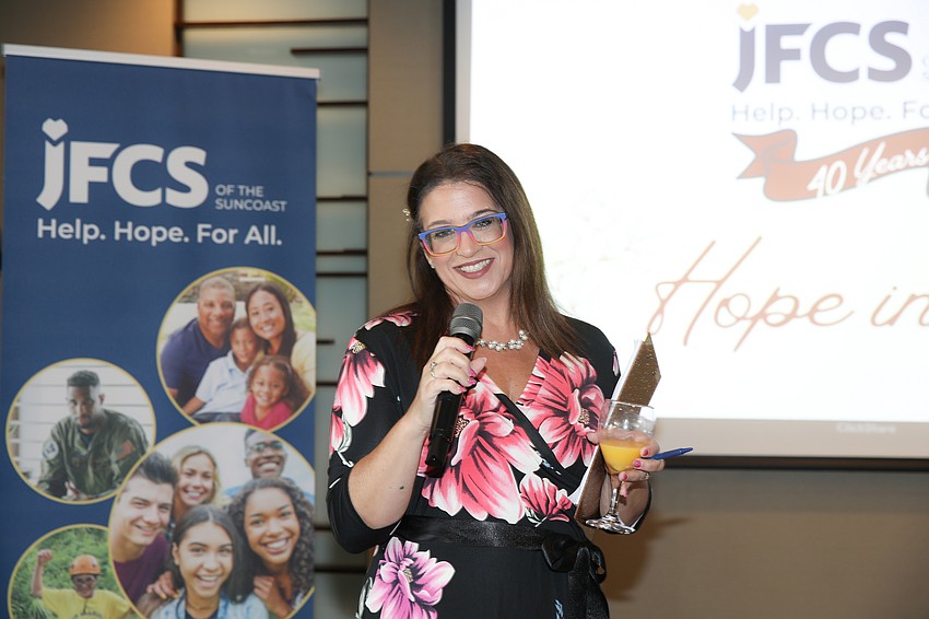 Vallye Adams serves as emcee and auctioneer at Hope for Bloom.