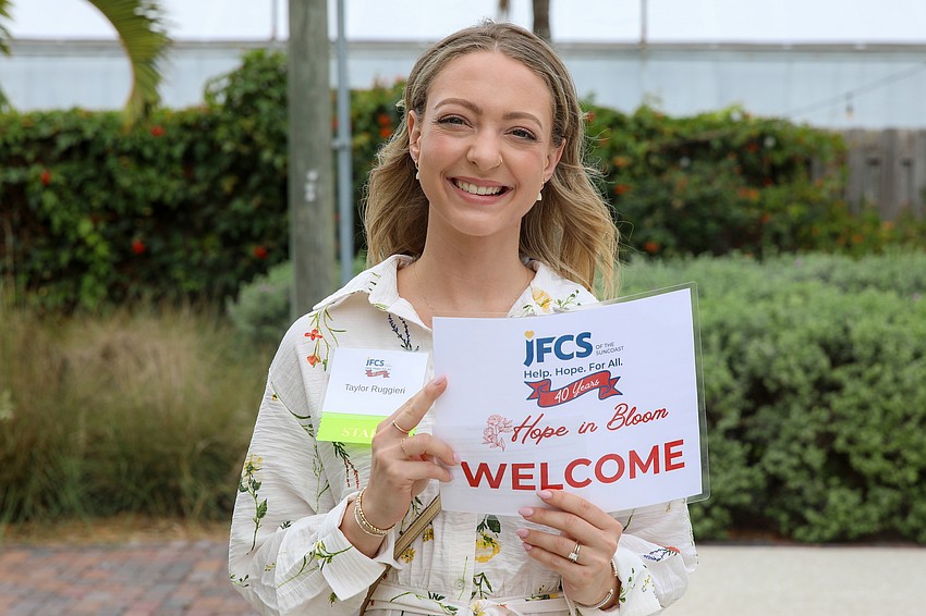 Taylor Ruggeri greets Hope in Bloom guests at Marie Selby Botanical Gardens on March 29.