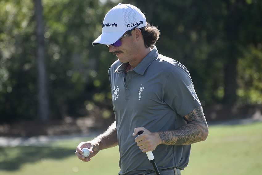 Ross Steelman grins after sinking a putt on the 17th green. He shot two over par in his second round and is below the projected cut line at two over par overall.