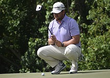 Mitchell Meissner lines up his putt on the third green of the Commander Course at Lakewood National Golf Club. He carded six under par in the second round, pulling into a 10-way tie for 10th place.