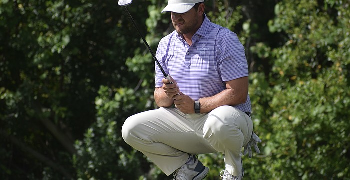 Mitchell Meissner lines up his putt on the third green of the Commander Course at Lakewood National Golf Club. He carded six under par in the second round, pulling into a 10-way tie for 10th place.