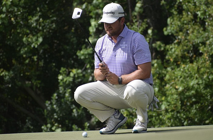 Mitchell Meissner lines up his putt on the third green of the Commander Course at Lakewood National Golf Club. He carded six under par in the second round, pulling into a 10-way tie for 10th place.