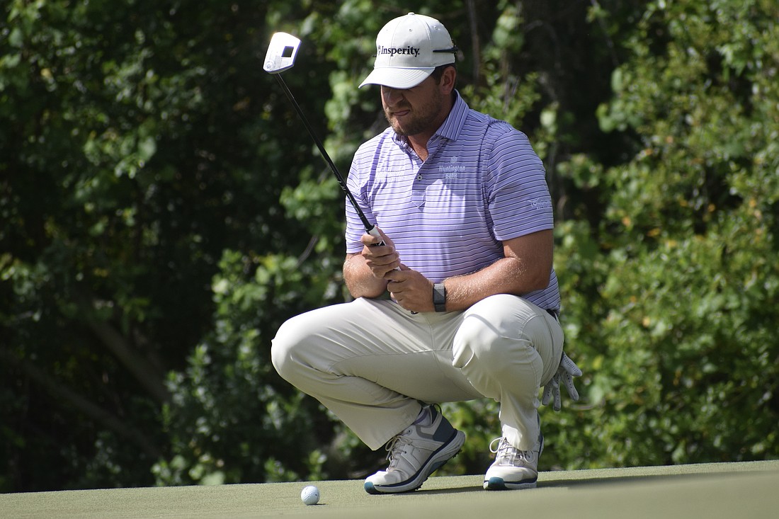 Mitchell Meissner lines up his putt on the third green of the Commander Course at Lakewood National Golf Club. He carded six under par in the second round, pulling into a 10-way tie for 10th place.