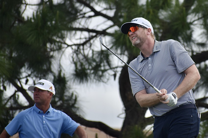 Ryan Brehm (right) and Chez Reavie (left) watch Brehm's shot sail on the third hole. Brehm, who has two Korn Ferry Tour wins, finished even in the second round.