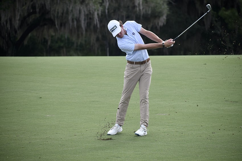 Logan McAllister hits an approach shot on the first hole. At three over par for the tournament, he's projected to be cut once the second round ends April 4.