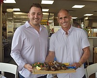 John Atanassov and Joel King, co-owners of Blu Kouzina, are eager to serve and get to know new customers at their new location at University Town Center.