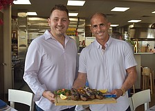 John Atanassov and Joel King, co-owners of Blu Kouzina, are eager to serve and get to know new customers at their new location at University Town Center.